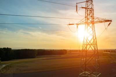 Beautiful sunset over the powerlines on the field